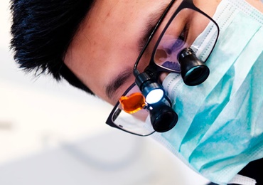 Dentist treating patient